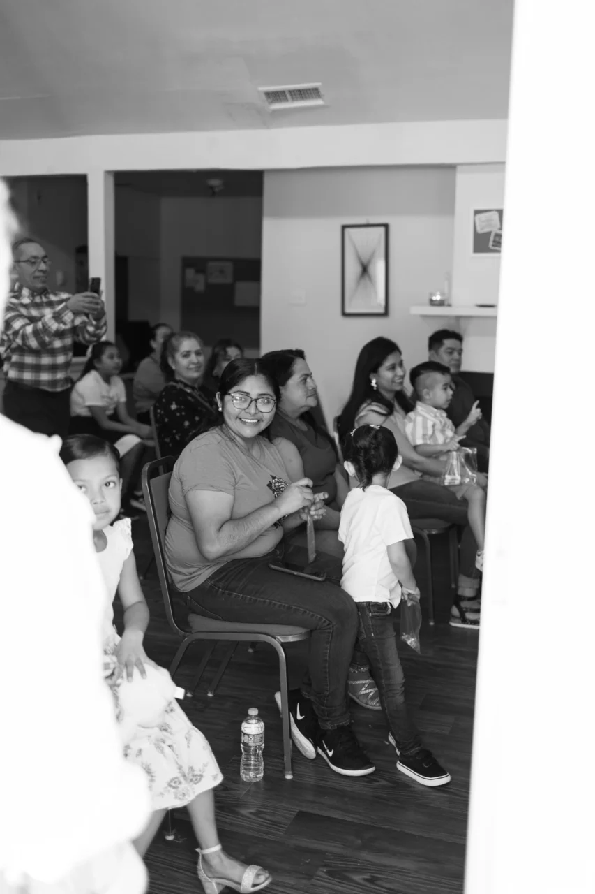 Click to expand image: students smiling in classroom